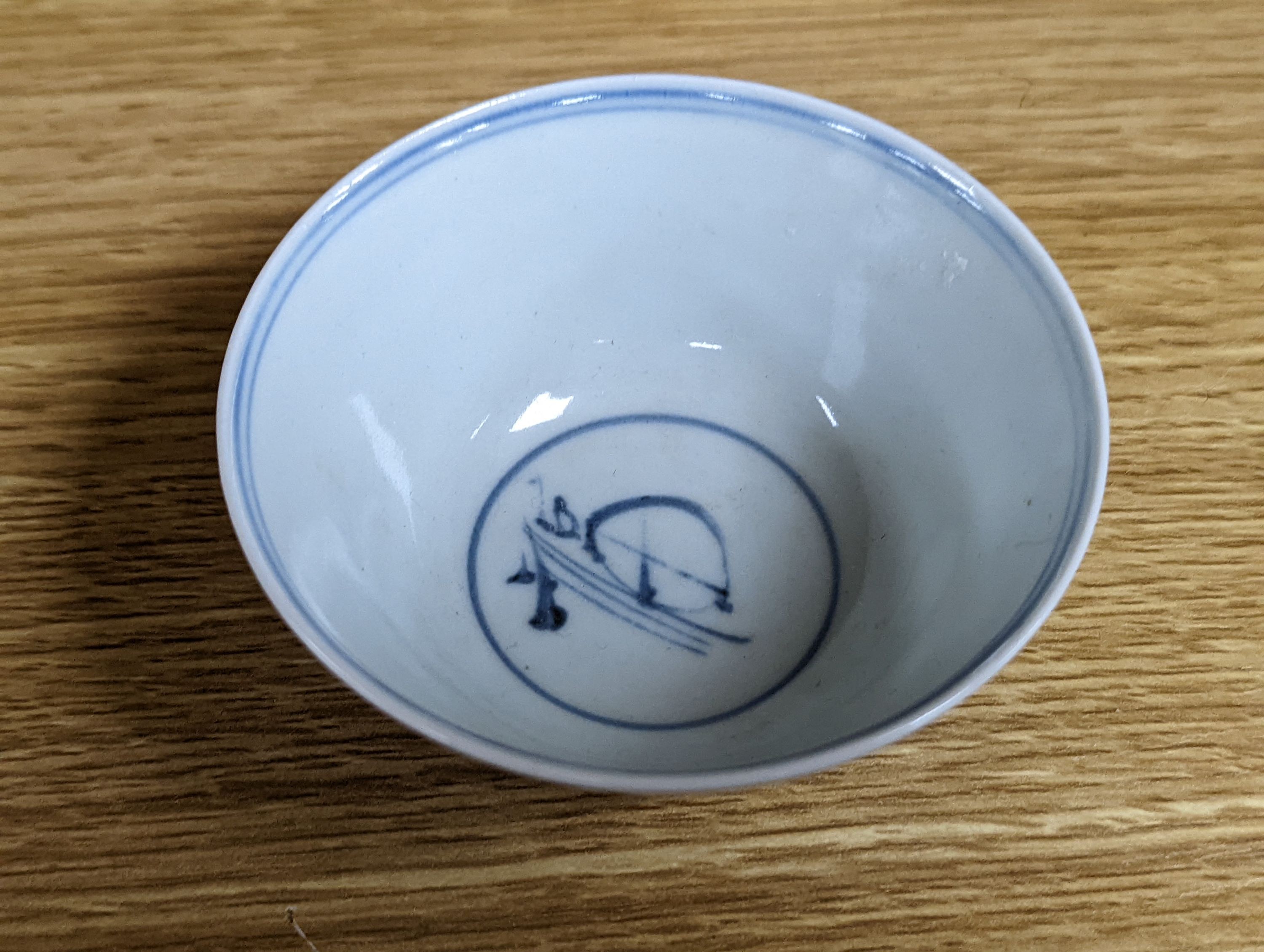 Two 18th century Chinese export bowls, a similar tea bowl and another Chinese blue and white tea bowl, largest 20cm diameter